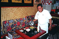 Waiter serving up good food in Acapulco