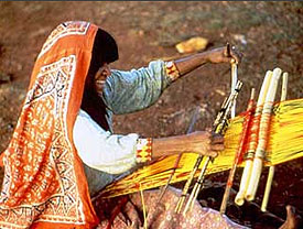 Huichol woman weaving.